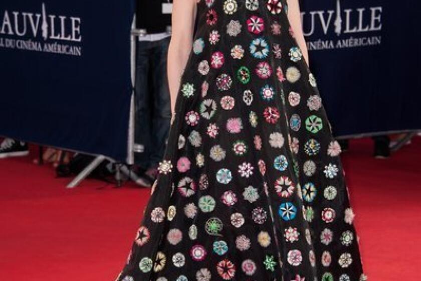 Cate Blanchett arrives in an embroidered black silk dress by Dior Haute Couture for the screening of "Blue Jasmine" at the Deauville American Film Festival in Deauville, France.