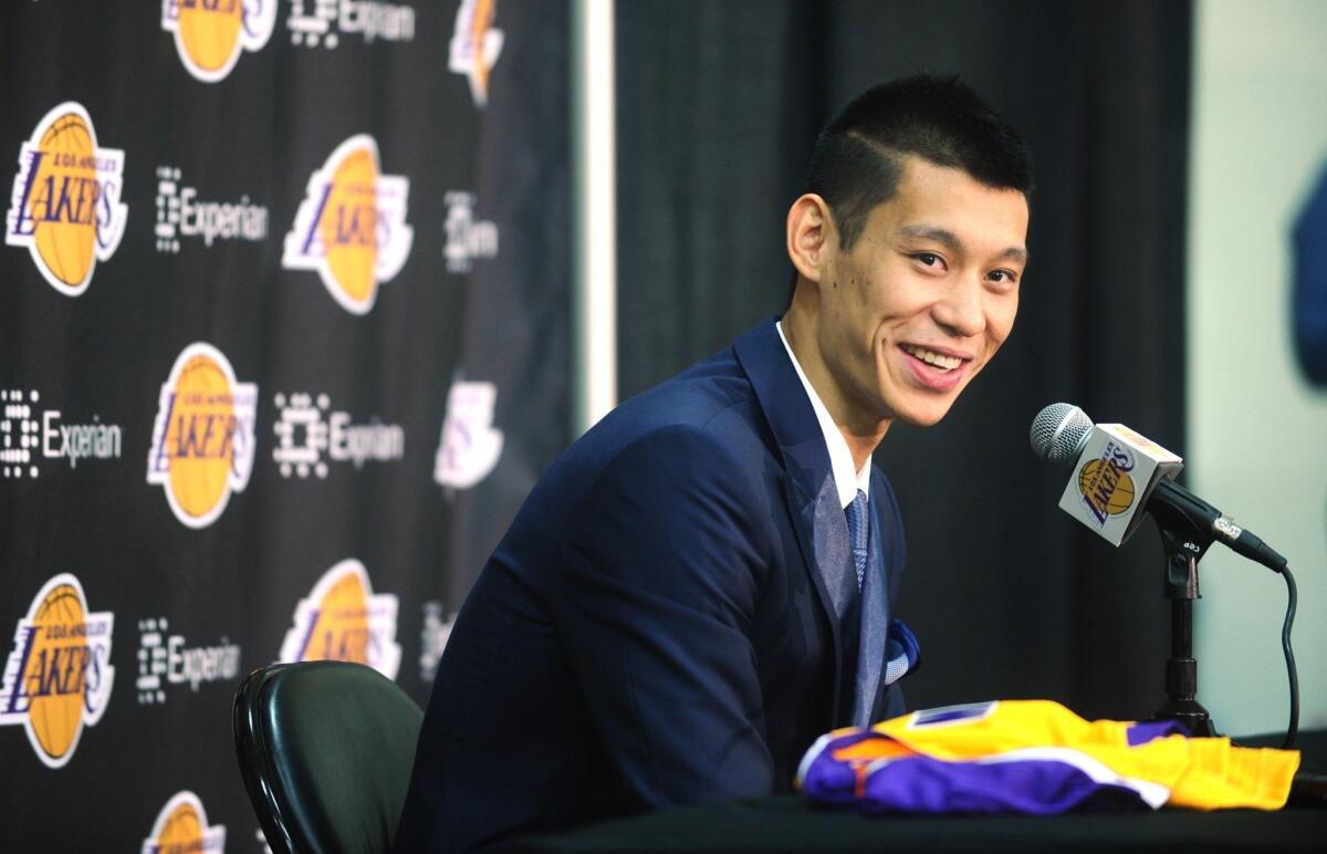 Jeremy Lin is introduced by the Lakers at a news conference Thursday at the team's training facility in El Segundo. Lin was acquired by the Lakers as part of a trade with the Houston Rockets earlier this month.