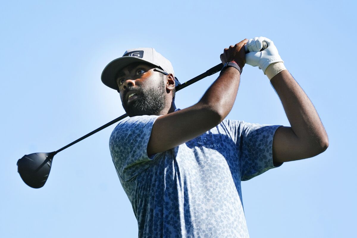 Sahith Theegala hits his tee shot at the third hole during the final round of the Phoenix Open.