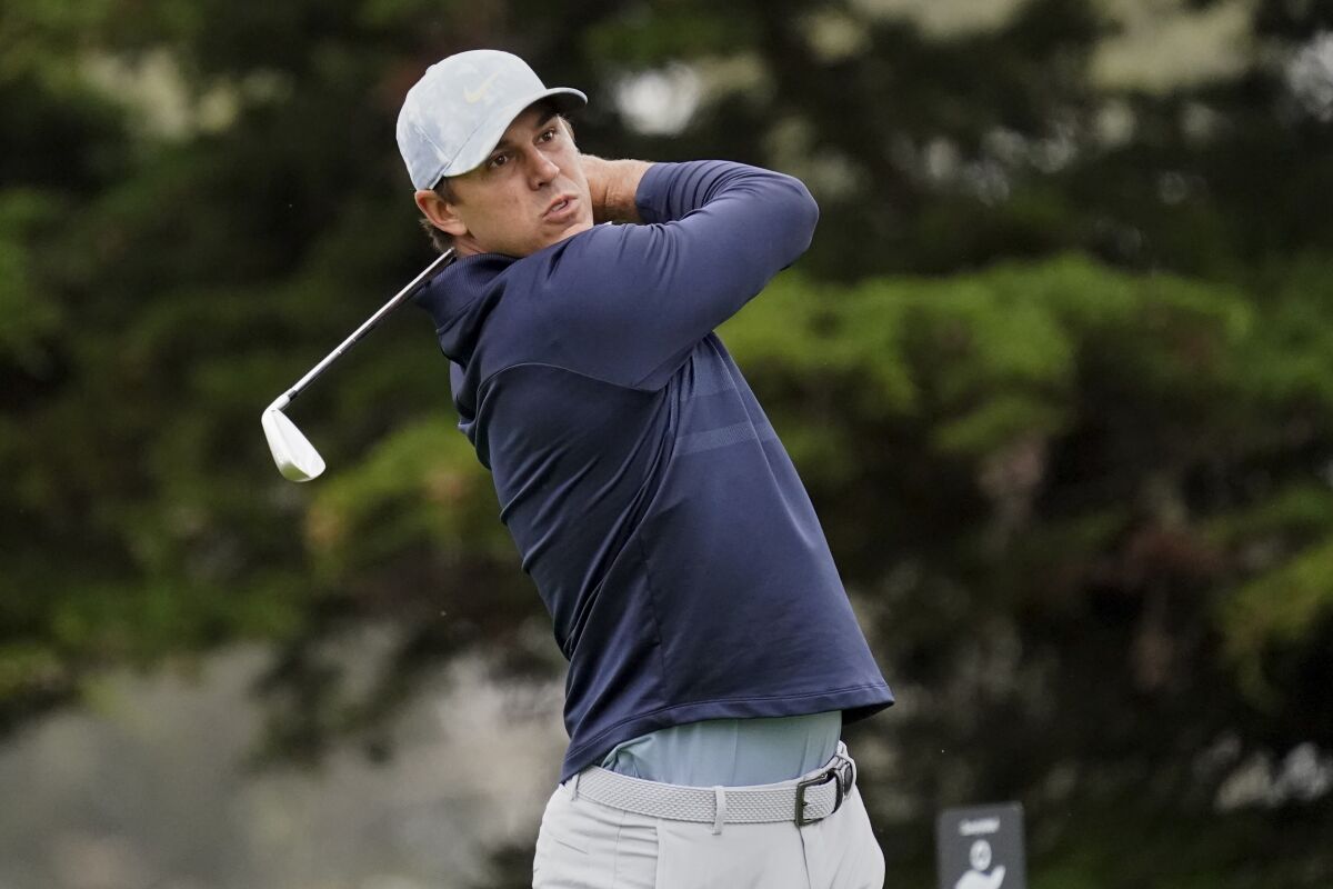 Brooks Koepka watches his tee shot on the 11th hole during the first round of the PGA Championship golf tournament at TPC Harding Park Thursday, Aug. 6, 2020, in San Francisco. (AP Photo/Jeff Chiu)