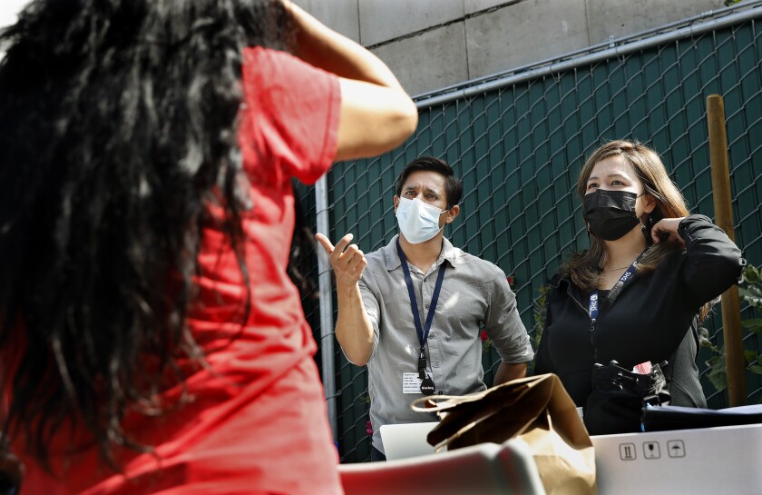 Can a Target gift card help sway you to stay off meth? 3 Dr. Siddarth Puri and nurse practitioner Marie Eugenio meet with a participant at Skid Row Community ReFresh Spot.