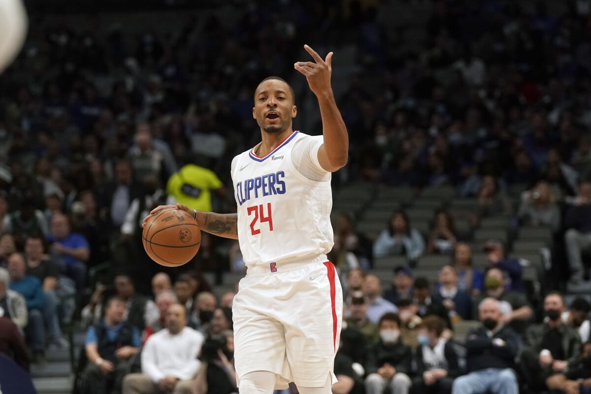 Clippers guard Norman Powell calls a play while bringing the ball up court.