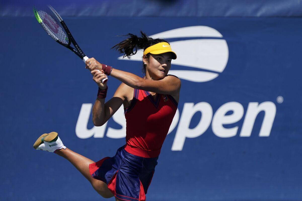 Emma Raducanu, from Britain, returns a shot to Shuai Zhang, of China,during the second round of the US Open tennis championships, Thursday, Sept. 2, 2021, (AP Photo/Seth Wenig)