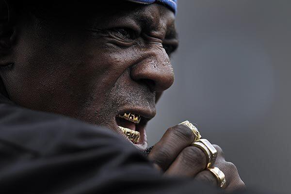 Flava Flav raps with Public Enemy during their set on Sunday afternoon as part of the Operation Skid Row festival on Gladys Avenue in downtown Los Angeles. The free show was put on by Chuck D and Public Enemy and featured other hip-hop acts.