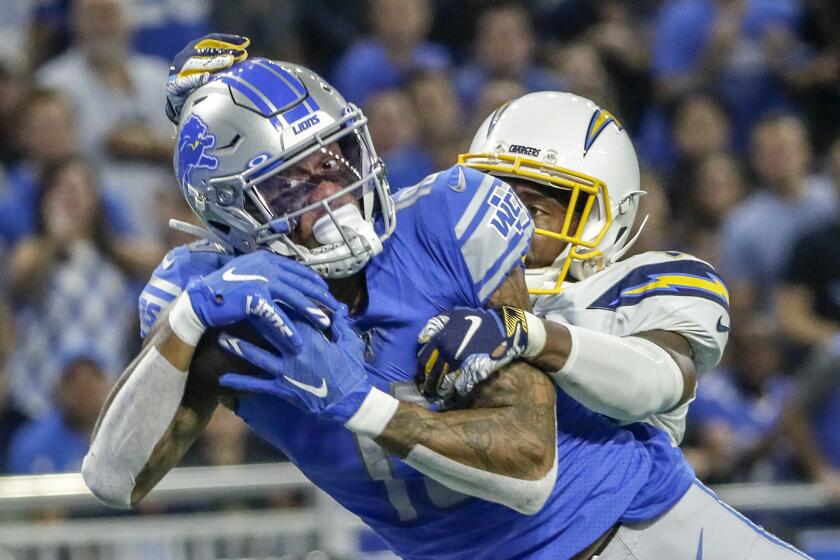 DETROIT, MICHIGAN, SUNDAY, SEPTEMBER 15, 2019 - Lions receiver Kenny Galladay catches a 31-yard touchdown pass from Matthew Stafford, beating Chargers cornerback Casey Hayward late in the fourth quarter at Ford Field. (Robert Gauthier/Los Angeles Times)