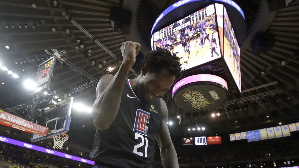 Clippers guard Patrick Beverley celebrates during the second half against the Golden State Warriors in Game 2 of a first-round of the NBA playoff in Oakland on Monday.