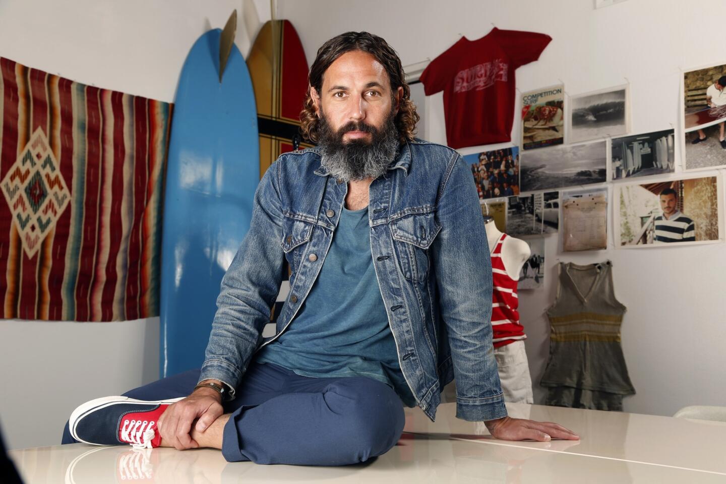 Designer John Moore poses in the studio of his L.A.-based luxe retro-surf label M.Nii. Moore was recently named by GQ as one of the best new menswear designers in America for 2014.