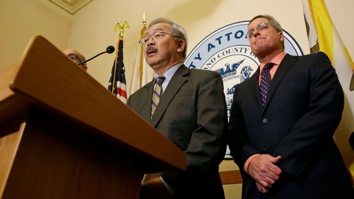 San Francisco Mayor Ed Lee, left, and City Atty. Dennis Herrera in January discuss the city's legal challenge to President Trump's executive order that would cut funding from municipal governments that refuse to aid federal immigration enforcement actions.
