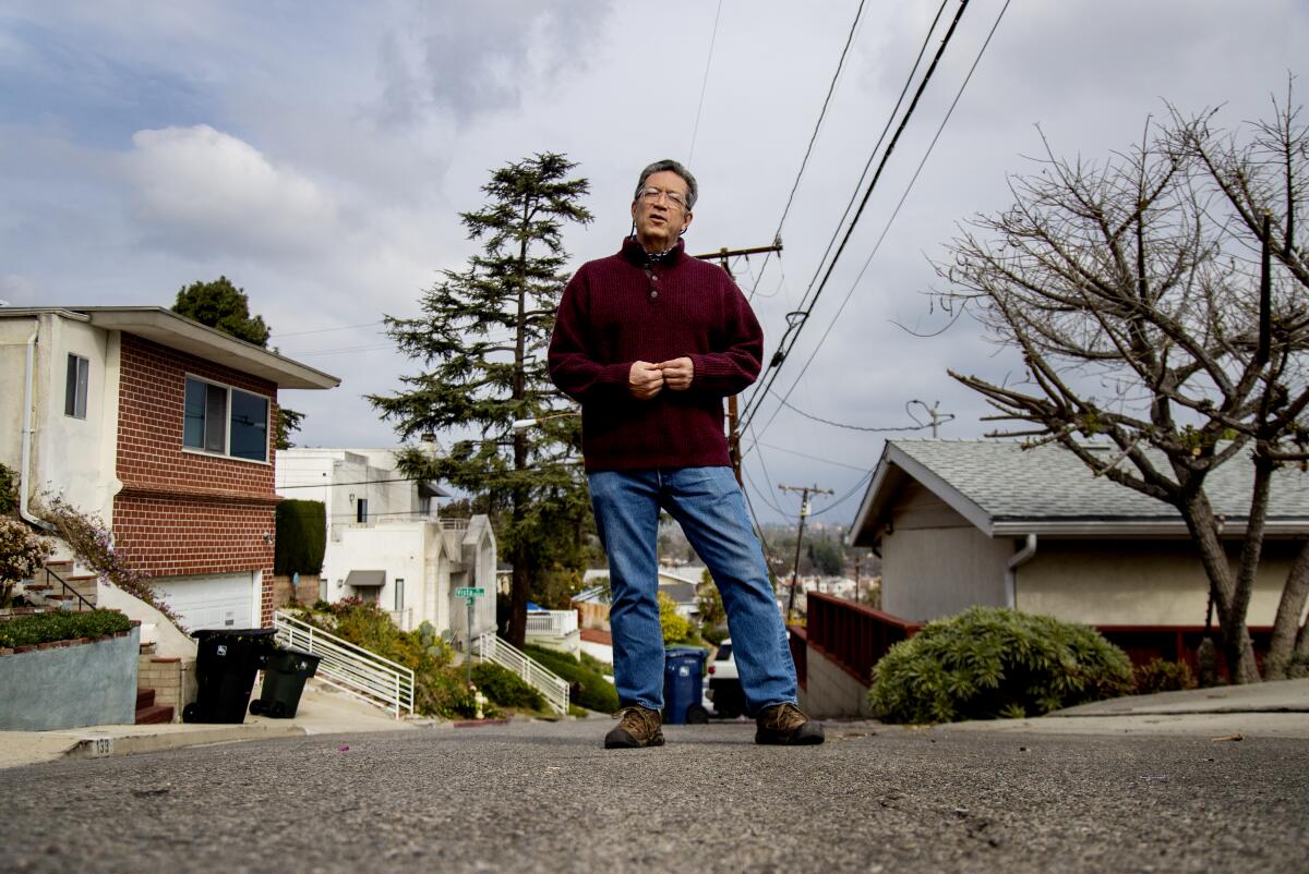  Poet and teacher Sesshu Foster of Alhambra stands in his neighborhood. 