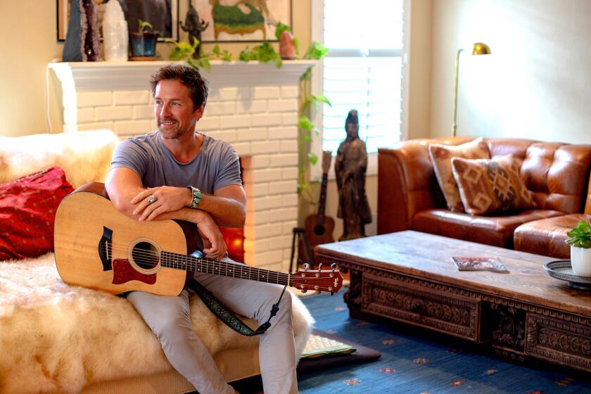 Actor and musician Paul Greene in the living room, his favorite room of the Culver City-adjacent home he shares with his fiancée, entrepreneur and actress Kate Austin, and his teenage son, Oliver.