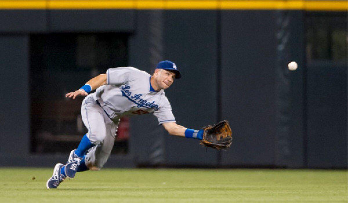 Skip Schumaker makes a diving catch against the Colorado Rockies on Sept. 4. Schumaker is likely to start in centerfield when the Dodgers open their National League Division Series against the Atlanta Braves on Thursday.