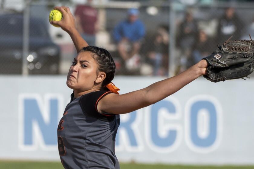 Huntington Beach's Grace Uribe pitches during a quarterfinal CIF Southern Section Division 1 playoff game against Norco on Thursday, May 24.