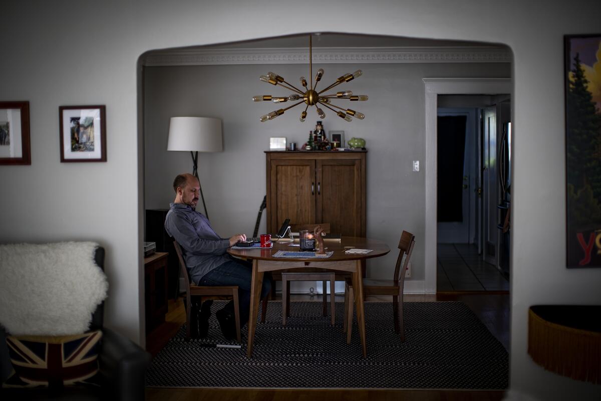 Comic book writer and magician Chad Allen works on his comic book, "Unseen," at home. The series features a blind heroine and was created for a blind audience, although sighted people can enjoy it just as much.