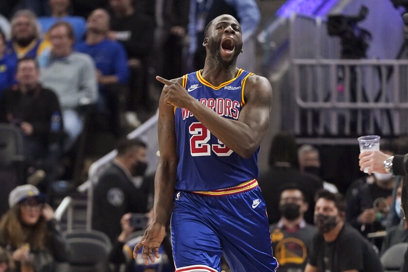 Golden State Warriors forward Draymond Green (23) reacts after being called for a foul during the second half of the team's NBA basketball game against the Phoenix Suns in San Francisco, Friday, Dec. 3, 2021. (AP Photo/Jeff Chiu)
