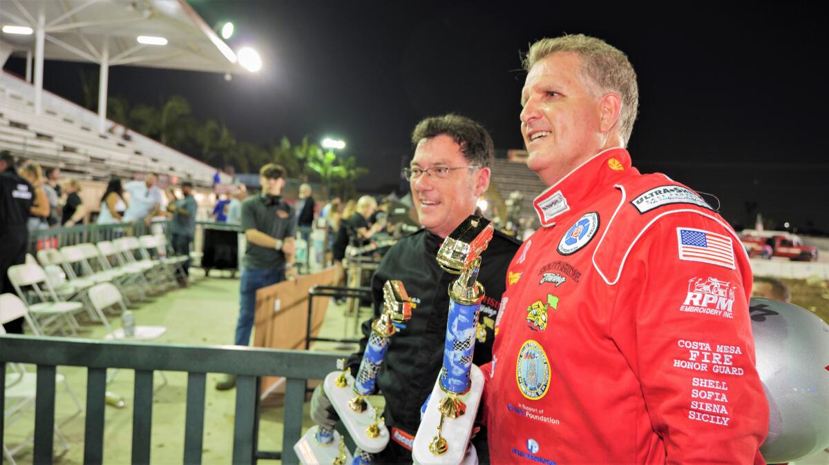 Costa Mesa Police Chief Ron Lawrence, left, and Fire Chief Dan Sefano at the 2023 Motorhome Madness demolition derby.