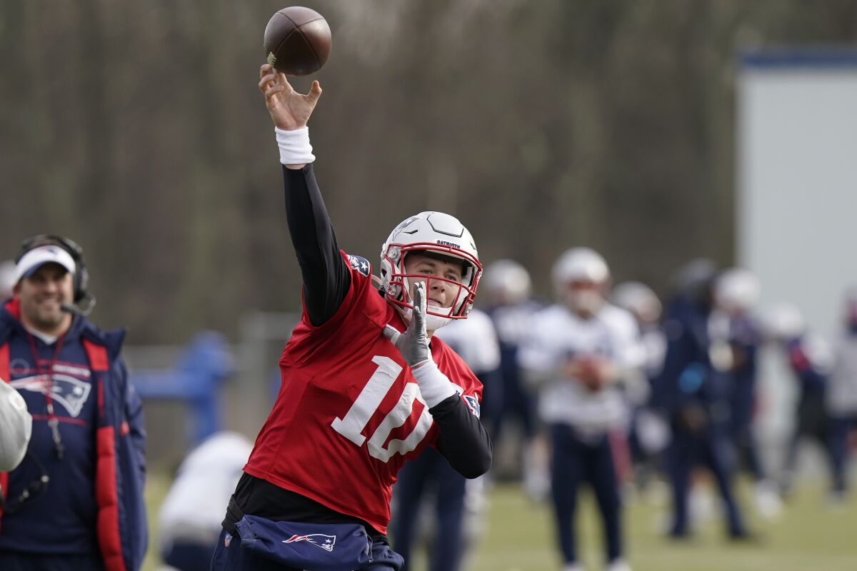 New England Patriots quarterback Mac Jones (10) delivers a pass during an NFL football practice, Wednesday, Dec. 15, 2021, in Foxborough, Mass. (AP Photo/Steven Senne)
