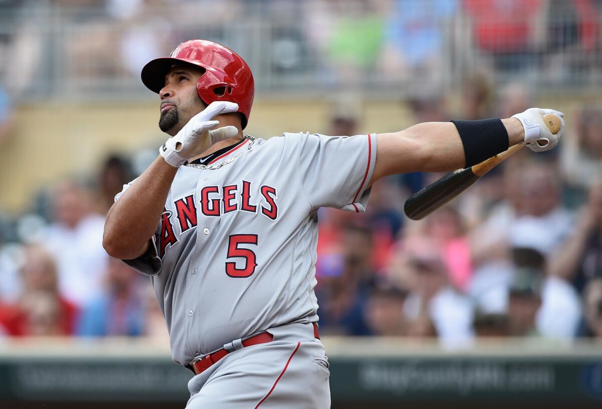 Angels slugger Albert Pujols hits a two-run home run in the first inning of a game against the Twins on April 17 in Minnesota.