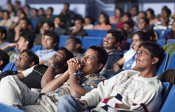 The audience watches a movie at San Jose's Towne Theatre, which specializes in Bollywood films.