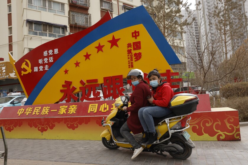 Government propaganda billboard in China's Xinjiang province