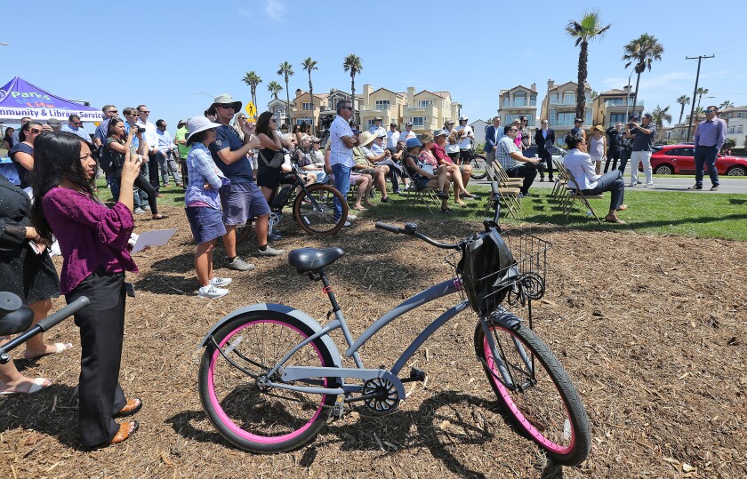 A crowd attends the Huntington Beach City Dedication Ceremony at Bluff Top Park on Monday.
