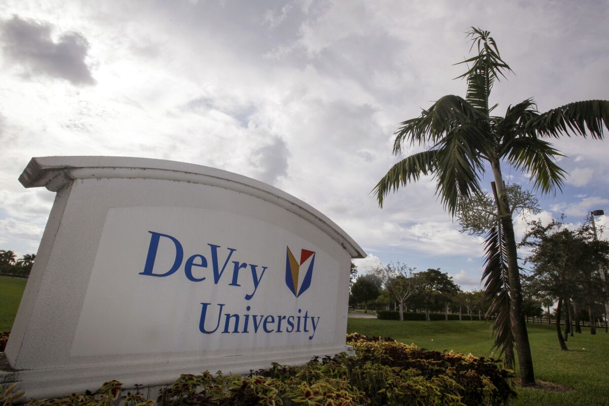 FILE - This Nov. 24, 2009, photo, shows the entrance to the DeVry University in Miramar, Fla. The Biden administration says it will cancel more than $70 million in student debt for borrowers who say they were defrauded by the for-profit DeVry University. It marks the first time the Education Department has approved such claims for an institution that's still in operation. (AP Photo/J Pat Carter, File)