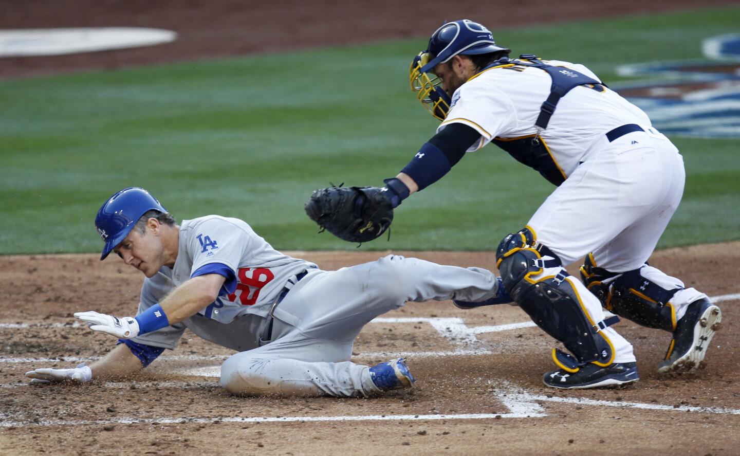 Dodgers infielder Chase Utley is tagged out by Padres catcher Derek Norris while trying to score on a Justin Turner hit in the third inning.