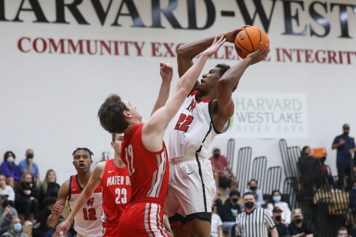 Harvard-Westlake's Landon Lewis controls the ball under pressure against Mater Dei on Feb. 11, 2022.