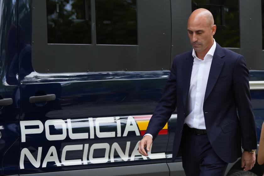 The former president of Spain's soccer federation Luis Rubiales, left, pases a police van as he leaves after testifying at the National Court in Madrid, Spain, Friday, Sept. 15, 2023. Spanish state prosecutors formally accused Rubiales last week of alleged sexual assault and an act of coercion after Rubiales kissed Spain forward Jenni Hermoso during the awards ceremony after Spain beat England to win the title on Aug. 20 in Sydney, Australia. (AP Photo/Manu Fernandez)