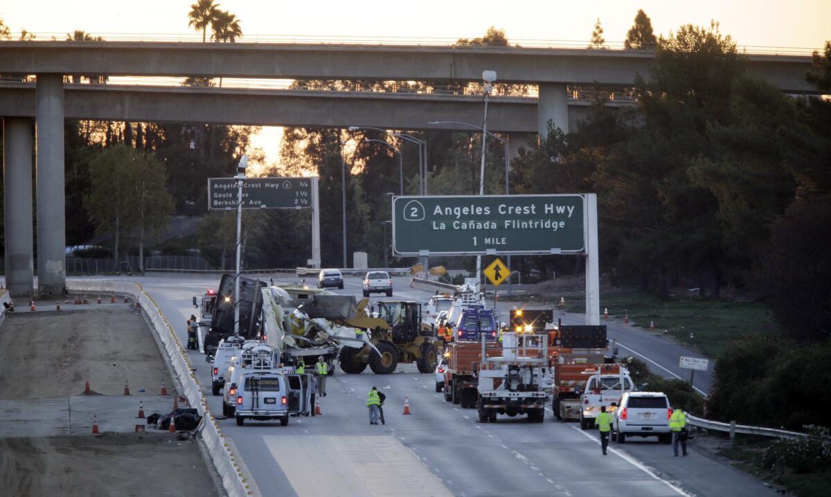 Clean-up efforts continue after a big rig on the 210 Freeway near La Ca–ada Flintridge overturned Wednesday morning, triggering a full shutdown of the eastbound lanes.