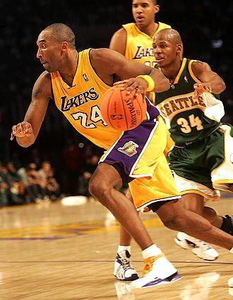 Lakers Kobe Bryant gets away from Seattle Supersonics Ray Allen at Staples Center Friday night.