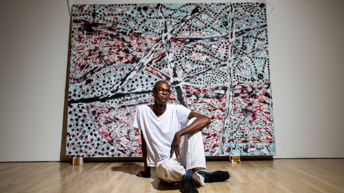 Los Angeles-born artist Mark Bradford in front of "The Next Hot Line" from his 2015 "Scorched Earth" show at the Hammer Museum.