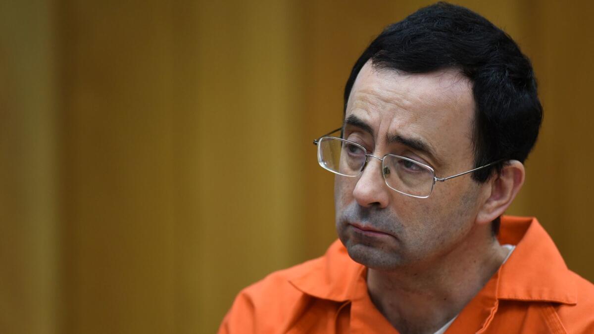 Larry Nassar listens during a hearing in a Charlotte, Mich., courtroom on Feb. 2.