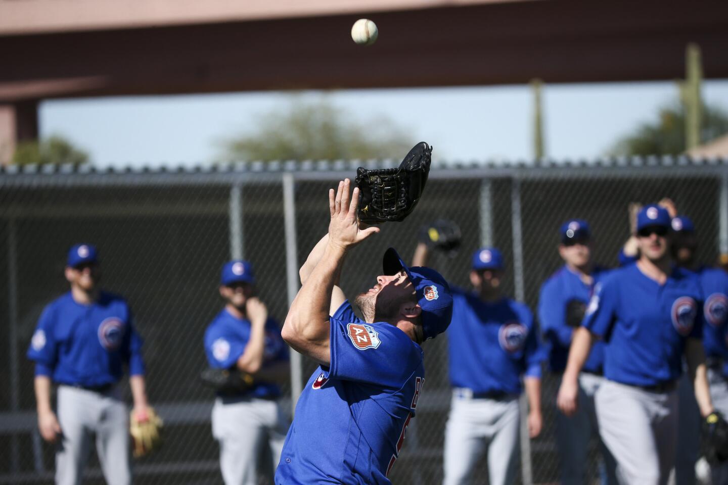 Rex Brothers fields fly balls during spring training at Sloan Park Friday, Feb. 26, 2016, in Mesa, Ariz.