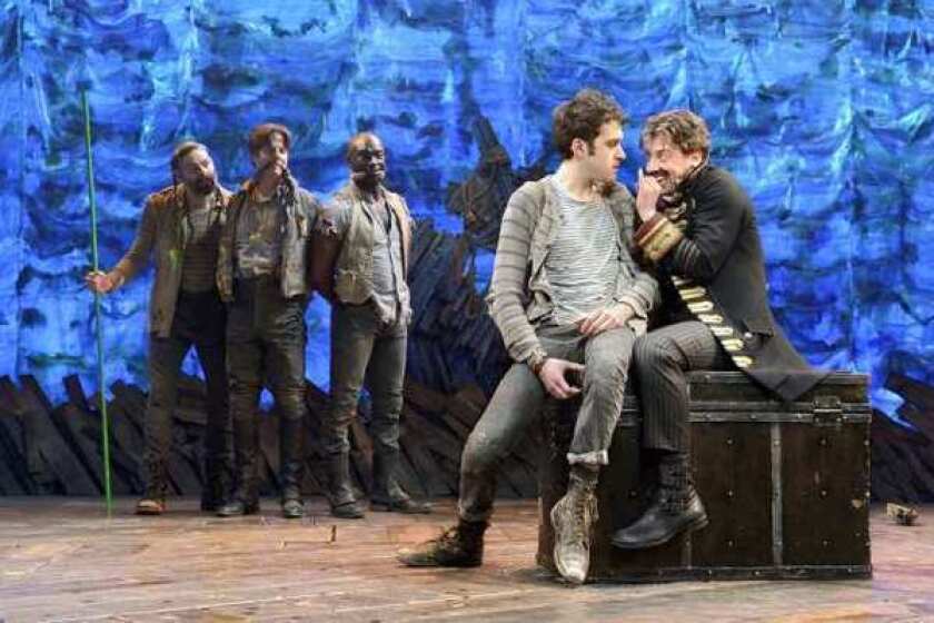 Christian Borle, right, plays a scene with Adam Chanler-Berat, second from right, in "Peter and the Starcatcher." Looking on at left are Matt D'Amico, Rick Holmes and Isaiah Johnson.