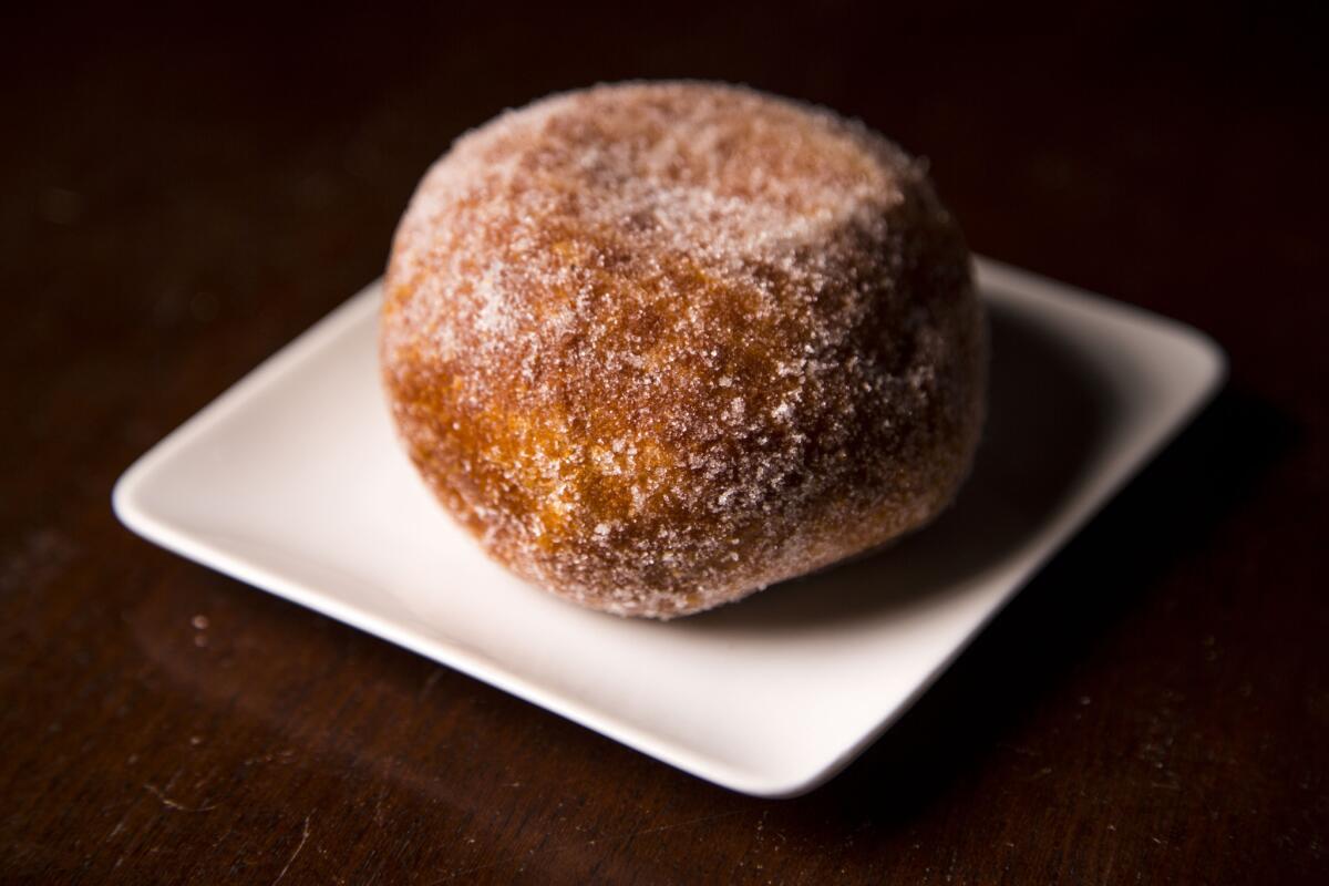An original flavor malasada (portuguese donut) from Leonard's Bakery on Kapahulu Avenue.
