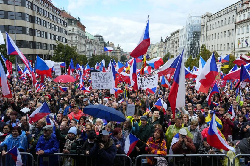 Several thousands of protesters from the far right and far left gathered to rally against the country's pro-Western Czech government at the Vencesla's Square in Prague, Czech Republic, Wednesday, Sept. 28, 2022. (AP Photo/Petr David Josek)