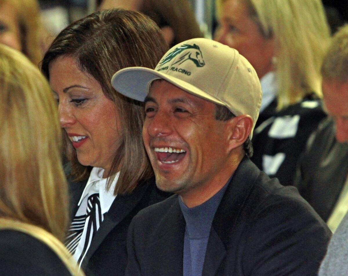 Triple Crown winning jockey Victor Espinoza shares a laugh before the Breeders' Cup Classic horse race post position draw at Keeneland Race Course in Lexington, Ky.