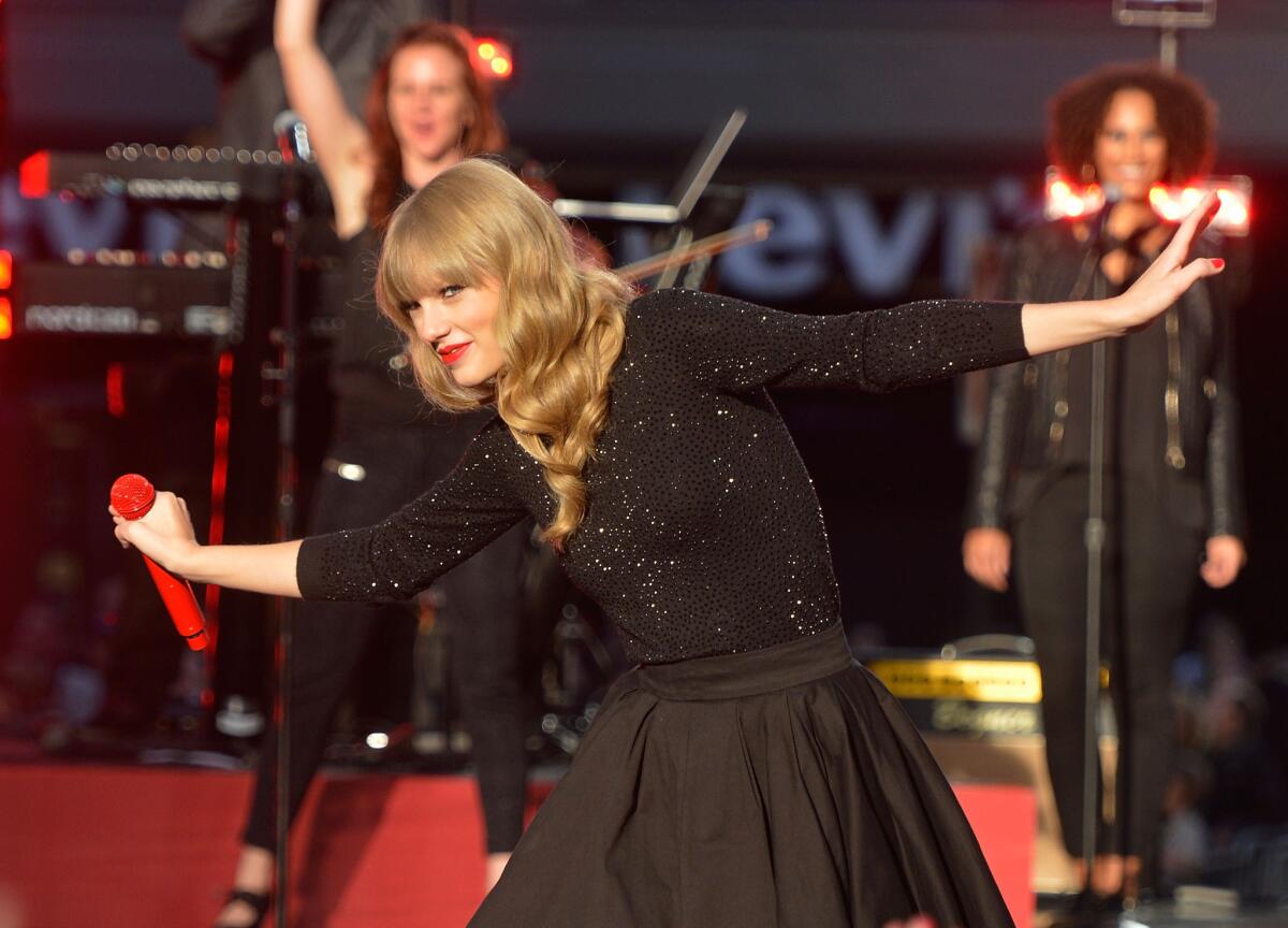 Taylor Swift, shown during her recent performance on "Good Morning America," sold 1.21 million copies of her new album "Red" in one week.