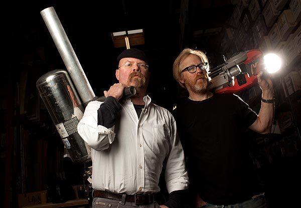Jamie Hyneman, left, and Adam Savage, the hosts of 'MythBusters,' pose at their studio/workshop in San Francisco in 2009.
