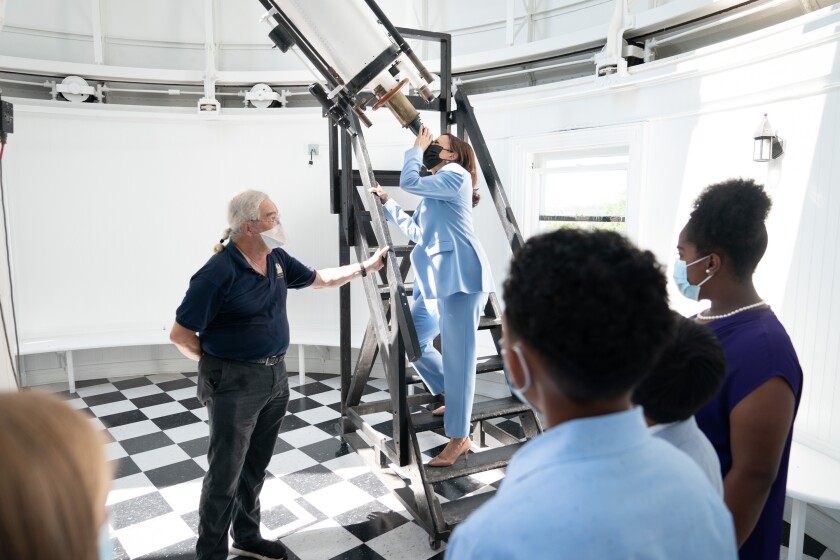 Vice President Kamala Harris looks through the telescope at the Naval Observatory.
