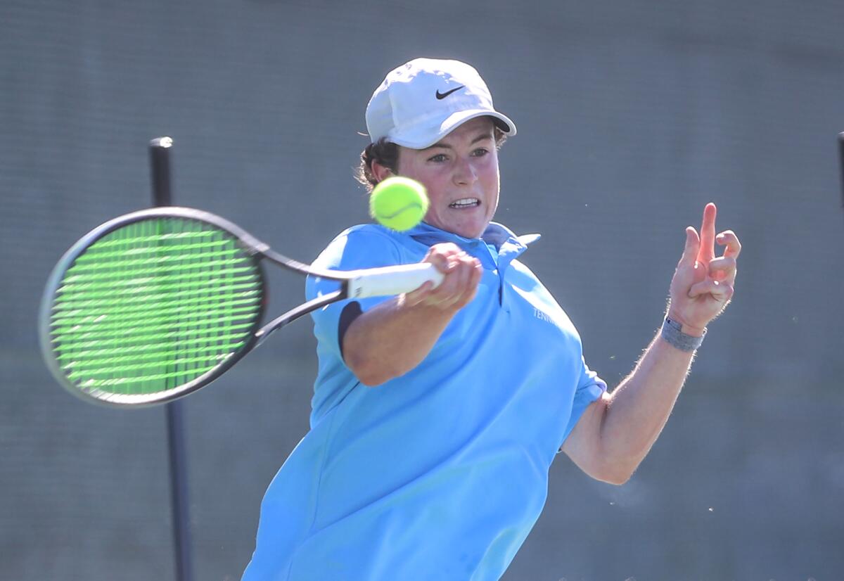 Corona del Mar's Jack Cross hits a forehand winner in his match against University's on Wednesday at University High.