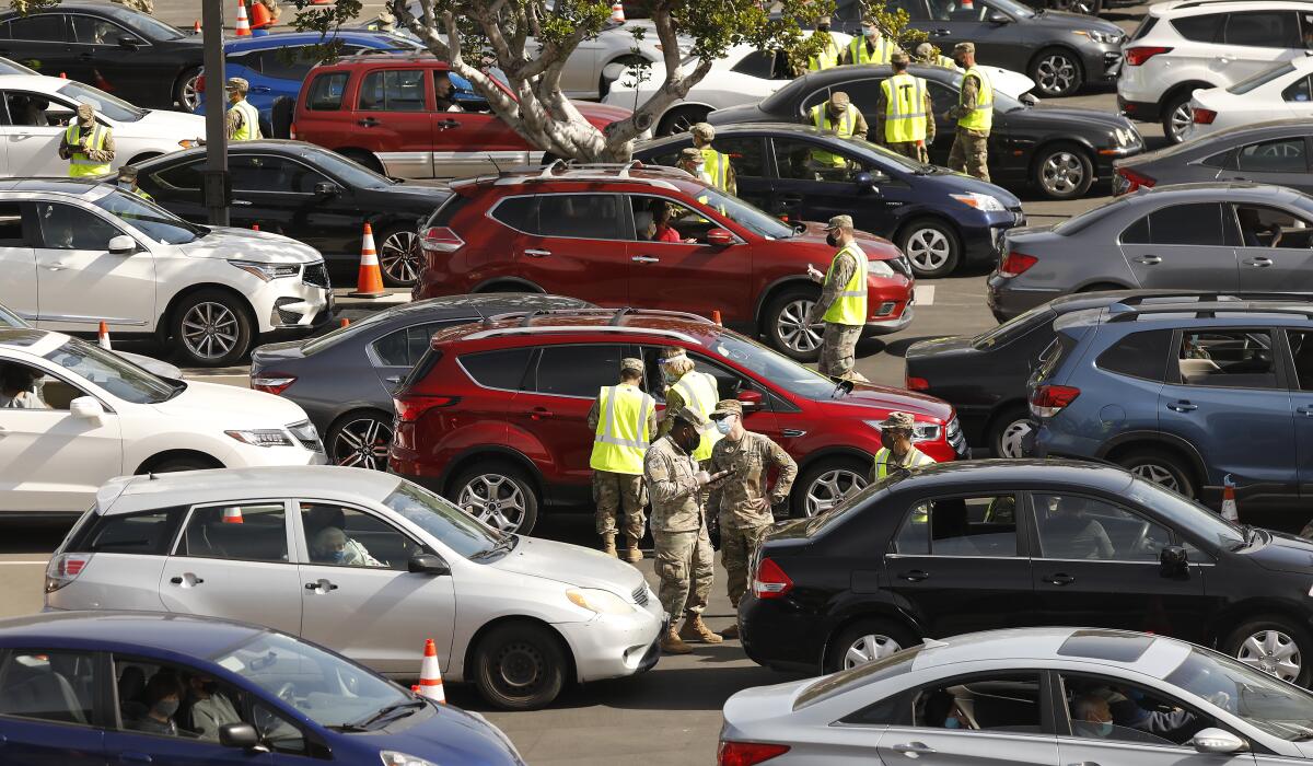 Cars are packed in a parking lot.