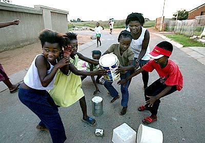 Children play in Diepkloof, Soweto, where the sense of community appeals to the Maimanes. Drugs and crime, though, persist.