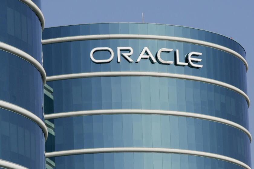 ** FILE **An exterior view of Oracle Corp. headquarters is shown in a Redwood City, Calif. file photo from Feb. 9, 2006. Business software maker Oracle Corp. is expected to post a fourth-quarter profit before certain costs of 28 cents a share on sales of $4.7 billion, the average estimates in a survey of analysts. (AP Photo/Paul Sakuma, File) ORG XMIT: NYBZ102