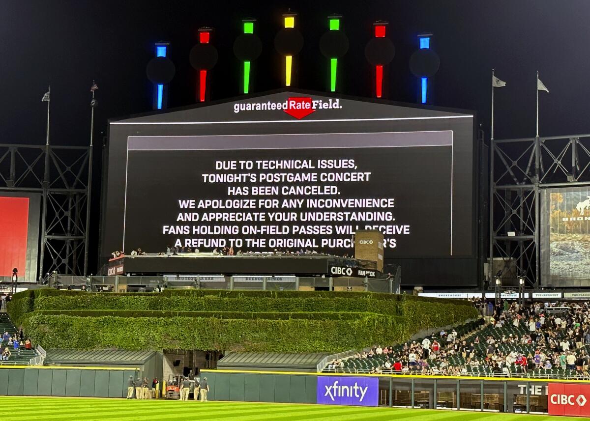 A message on the main scoreboard at Guaranteed Rate Field in Chicago announces the cancellation of a postgame concert.