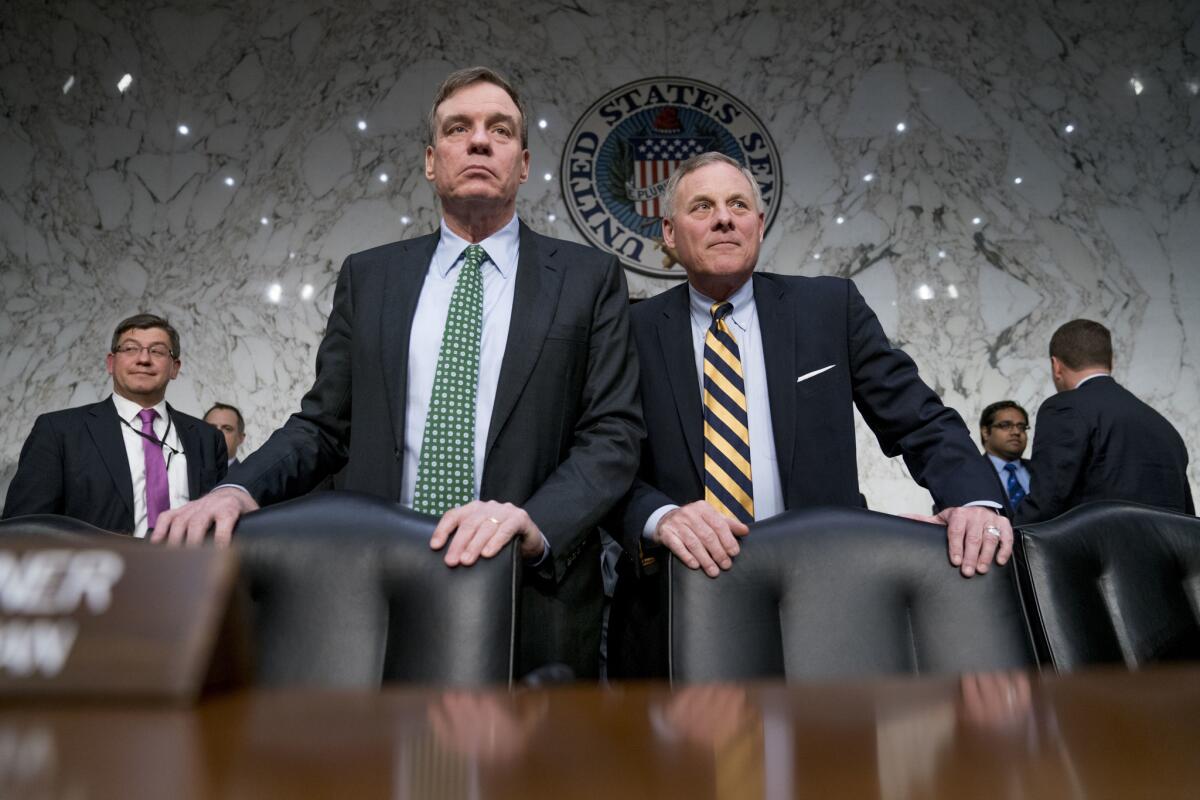 Senate Intelligence Chairman Richard M. Burr (R-N.C.), right, and Vice Chairman Mark R. Warner (D-Va.).