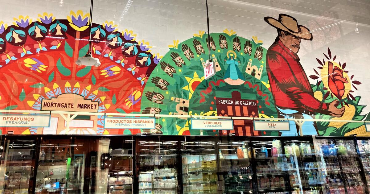 A mural shows Northgate Market founder Don Miguel González Jimenez with a heart representing wife Dona Teresa.
