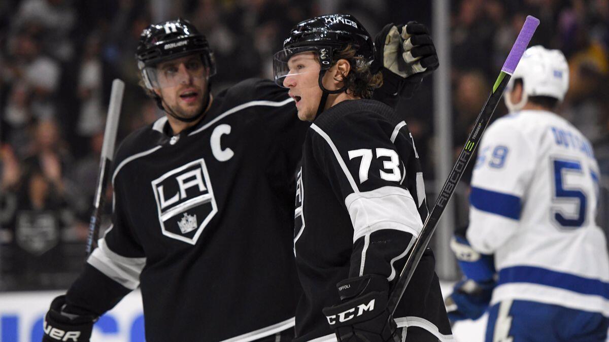 Kings center Tyler Toffoli (73) is congratulated by center Anze Kopitar after scoring against the Tampa Bay Lightning during the second period Nov. 9.