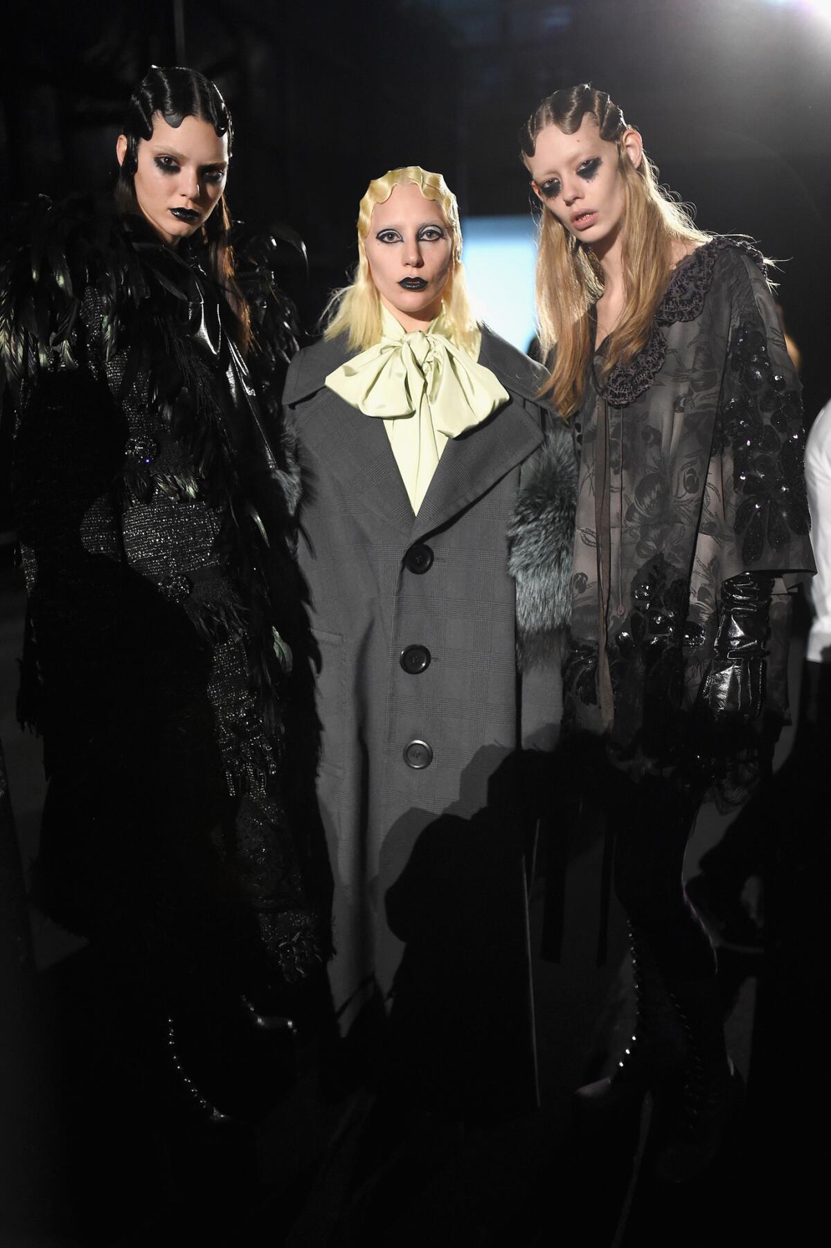 Kendall Jenner, left, and singer-songwriter Lady Gaga, center, pose with another model backstage at the Marc Jacobs Fall 2016 fashion show during York Fashion Week at Park Avenue Armory on Feb. 18, 2016.