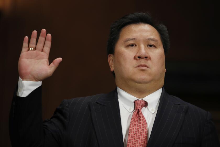 James Ho is sworn in during a Senate Judiciary Committee hearing on nominations on Capitol Hill in Washington, Wednesday, Nov. 15, 2017. Ho has been nominated to be United States Circuit Judge For The Fifth Circuit. (AP Photo/Carolyn Kaster)